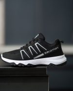 خرید اینترنتی کفش کتونی اسپرت زنانه دخترانه مدل سالامون سبک و جذاب رنگ مشکی زیره سفید ساده اصفهان