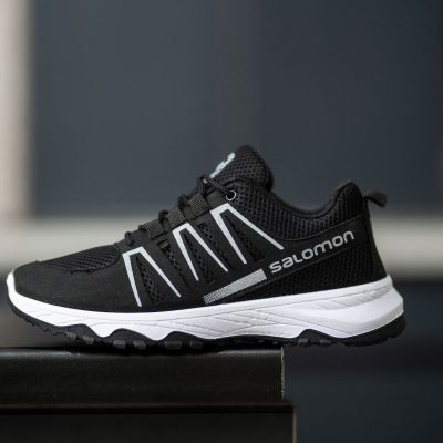 خرید اینترنتی کفش کتونی اسپرت زنانه دخترانه مدل سالامون سبک و جذاب رنگ مشکی زیره سفید ساده اصفهان