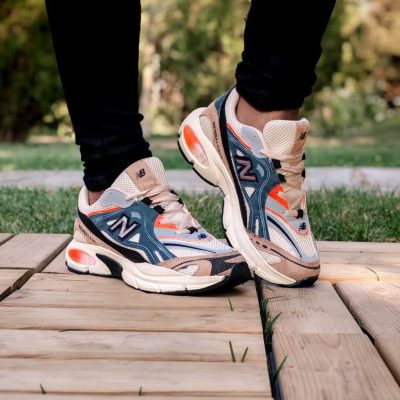 خرید اینترنتی کفش کتونی اسپرت مردانه و پسرانه مدل نیوبالانس طرح کپسولی چشم نواز و عالی رنگ کرم ابی جذاب اصفهان