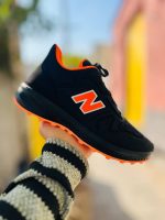 خرید اینترنتی کفش کتونی اسپرت مردانه و پسرانه مدل نیوبالانس بسیار مقاوم و بادوام رنگ مشکی نارنجی ویژه اصفهان
